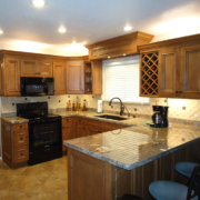 Modern kitchen with granite countertops and wooden cabinets Modern kitchen with granite countertops and wooden cabinets